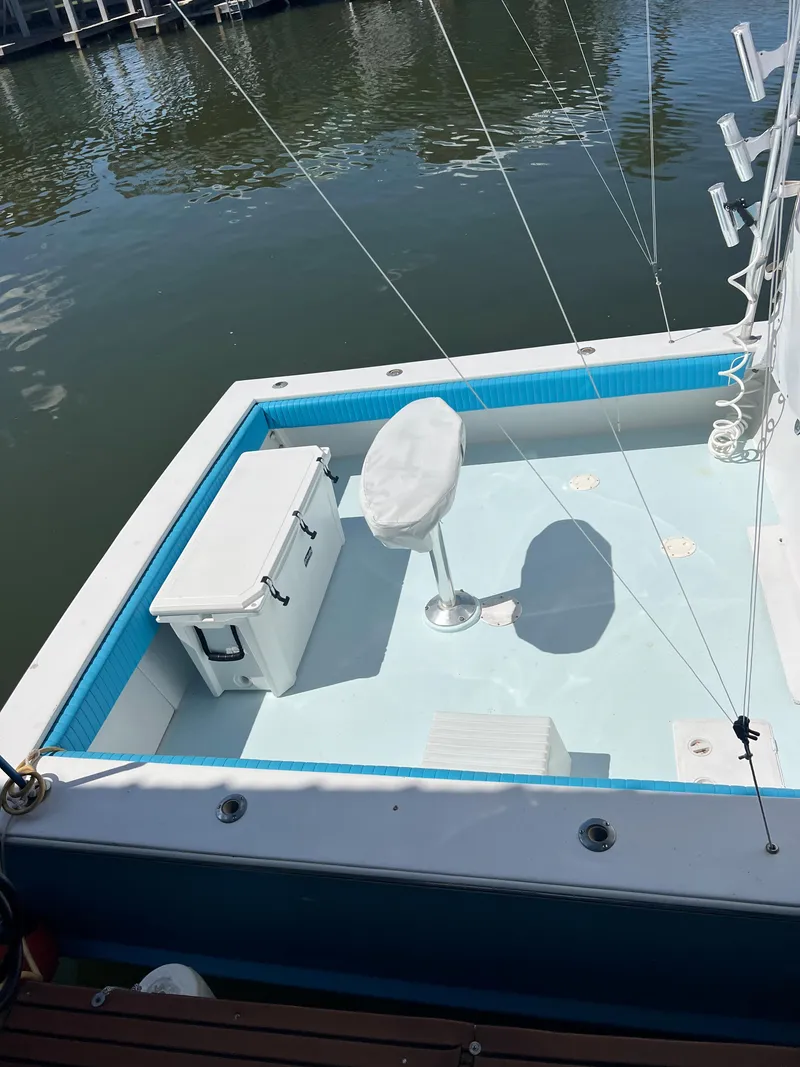 Slide: The Image of 1985 Custom Mabry Edwards boat deck with fishing chair and cooler. - 3