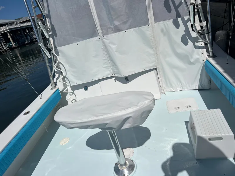 Slide: The Image of 1985 Custom Mabry Edwards boat deck with covered seat and fishing rod holders. - 4