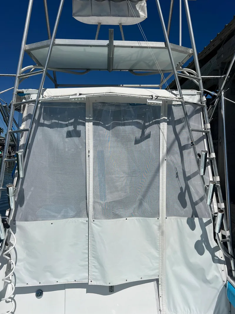 Slide: The Image of Custom 1985 Mabry Edwards boat with white canopy and ladder. - 5