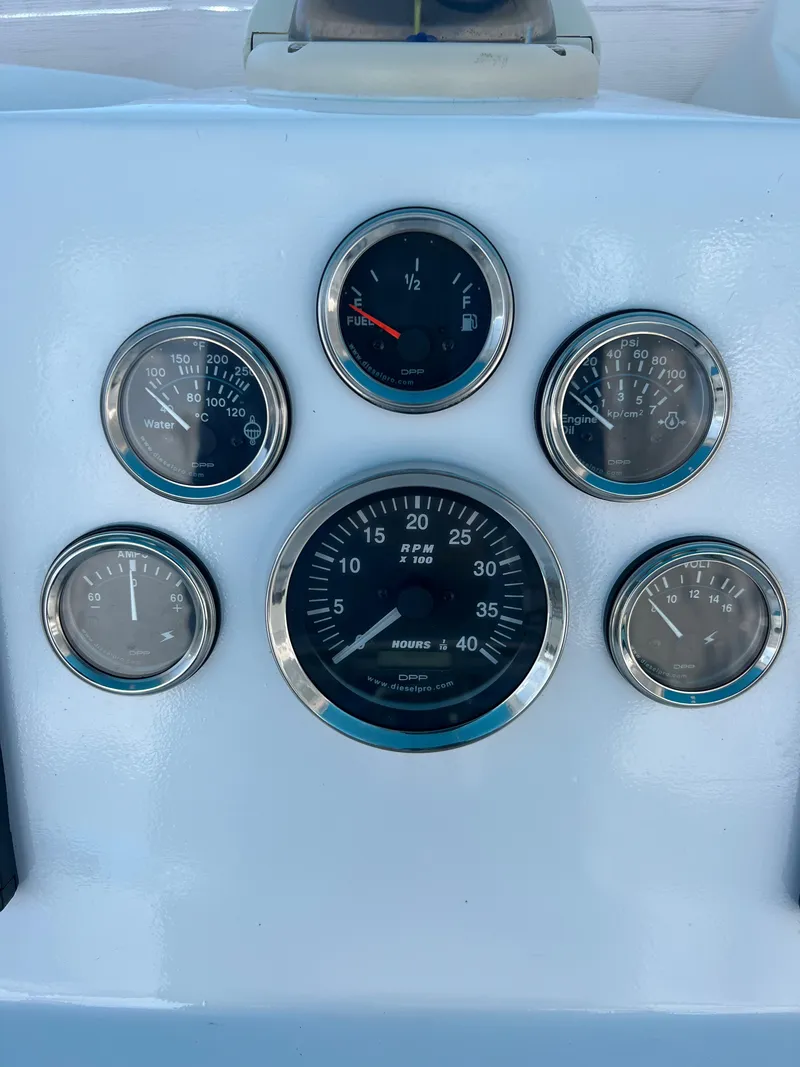 Slide: The Image of Alt text: 1985 Custom Mabry Edwards boat dashboard with gauges. - 9