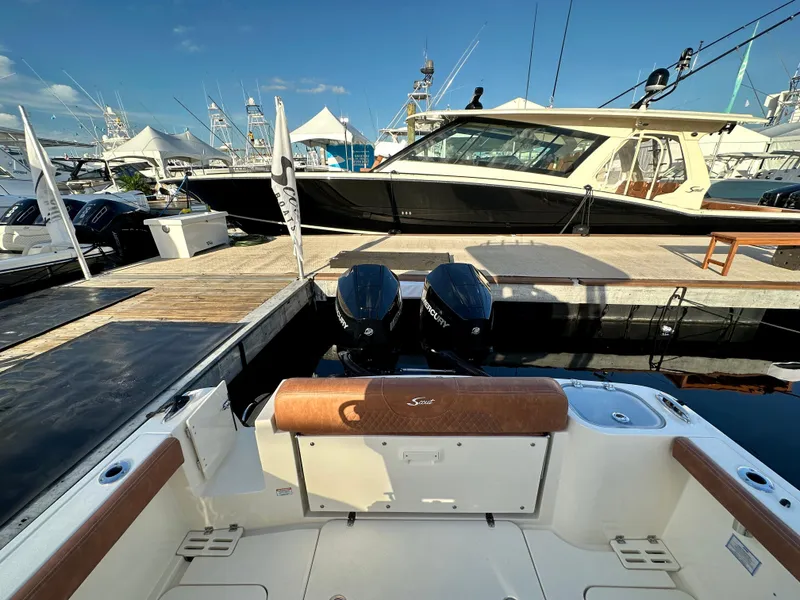 Slide: The Image of Scout 260 LXF 2025 at dock with engine view. - 11