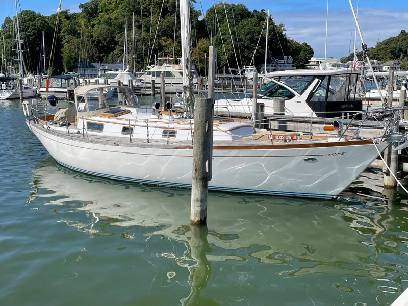 The Image of 1977 Cheoy Lee 41' Offshore sailboat docked in a marina. - 0