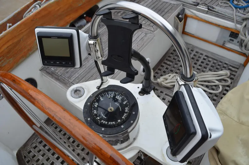 Slide: The Image of 1977 Cheoy Lee 41' Offshore yacht helm with compass and navigation instruments. - 12