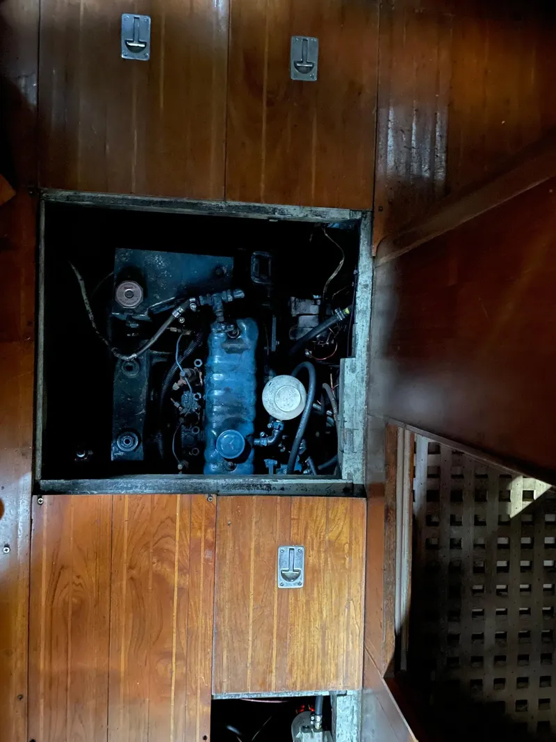 Slide: The Image of Engine compartment of a 1977 Cheoy Lee 41' Offshore yacht with wooden flooring. - 23
