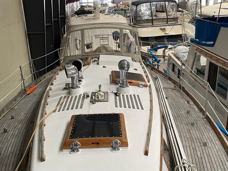 Slide: The Image of 1977 Cheoy Lee 41' Offshore yacht in storage, showcasing deck and cabin details. - 5