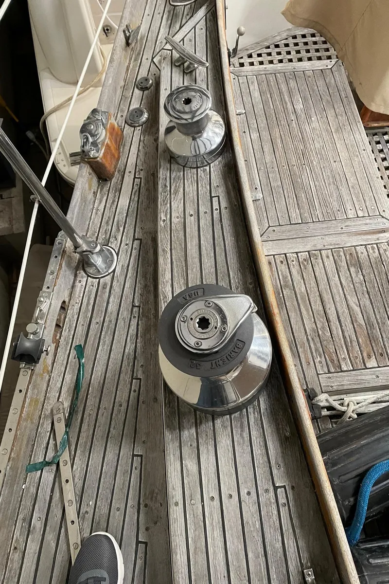 Slide: The Image of 1977 Cheoy Lee 41' Offshore sailboat deck with winches and wooden finish. - 7