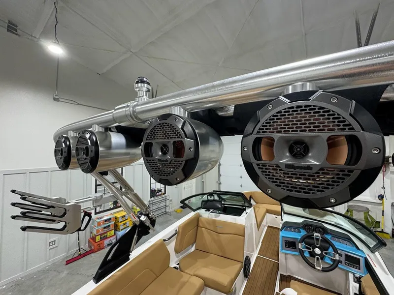 Slide: The Image of 2022 MasterCraft NXT24 boat with premium sound system and tan interior. - 18