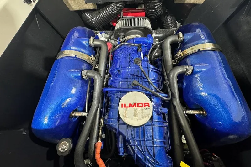 Slide: The Image of 2022 MasterCraft NXT24 Ilmor MPI engine in blue. - 22