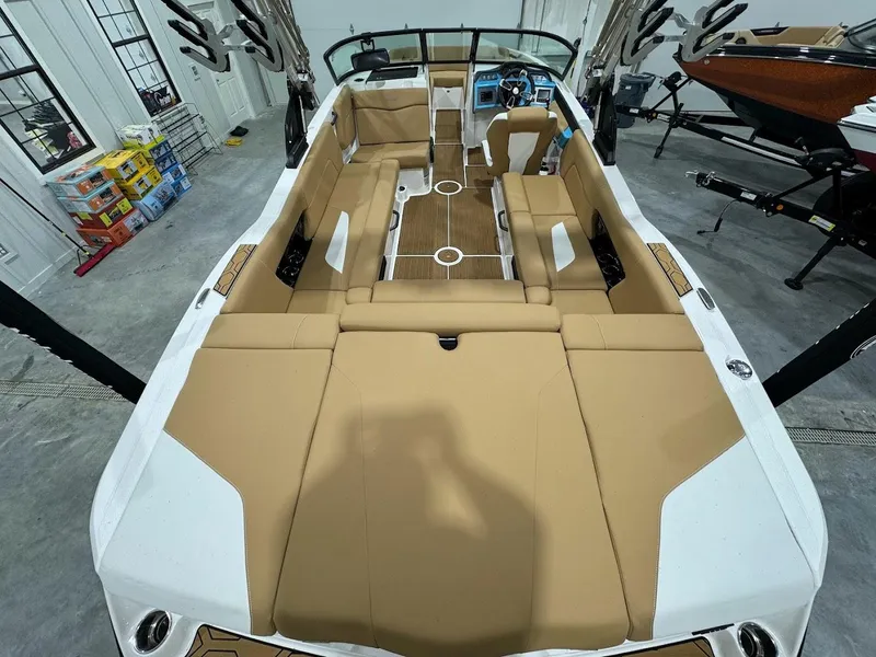 Slide: The Image of 2022 MasterCraft NXT24 boat interior with tan upholstery and spacious seating. - 8