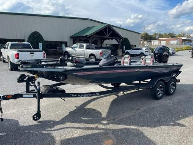 The Image of 2024 Ranger RT198P bass boat on trailer in parking lot. - 0
