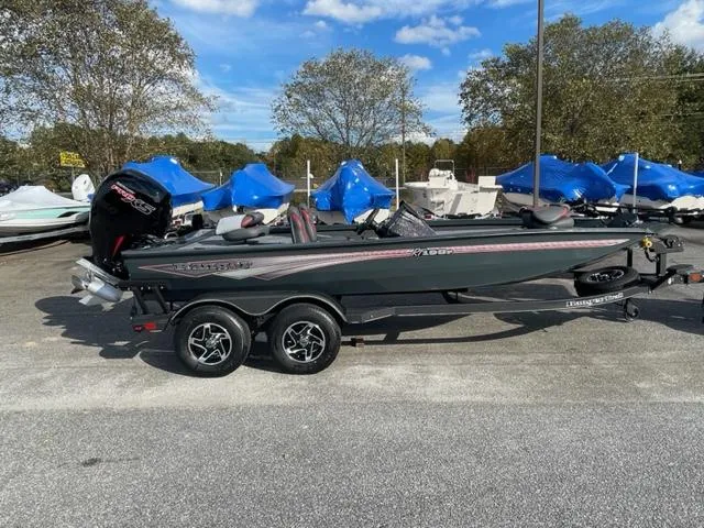 Slide: The Image of 2024 Ranger RT198P fishing boat on a trailer in a parking lot. - 4