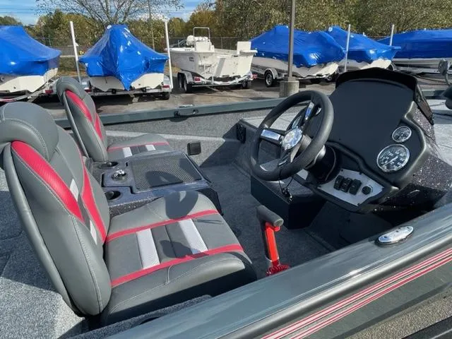 Slide: The Image of 2024 Ranger RT198P boat interior with steering wheel and dual seats. - 8