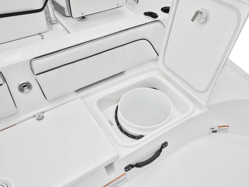 Slide: The Image of 2024 Yamaha Boats 195 FSH Sport interior storage compartment with open lid. - 11