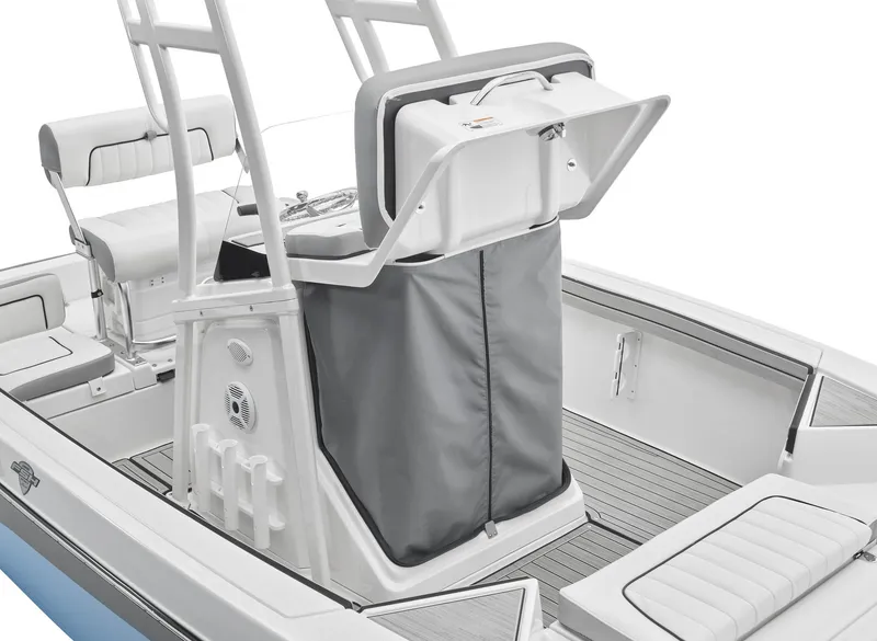 Slide: The Image of 2024 Yamaha Boats 195 FSH Sport center console with storage compartment open. - 3