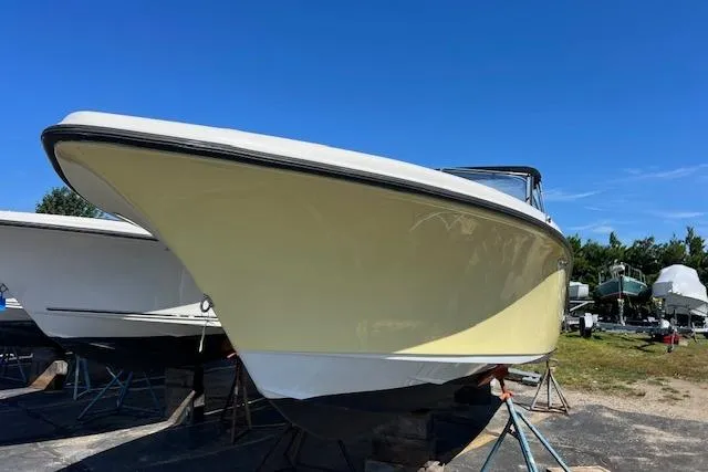 Slide: The Image of 2020 Key West 239 DFS boat on stands under clear blue sky. - 3