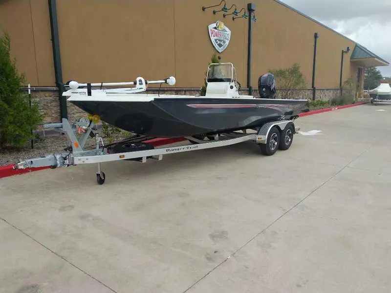 Slide: The Image of 2024 Ranger RB200 boat on a trailer in a parking lot. - 0