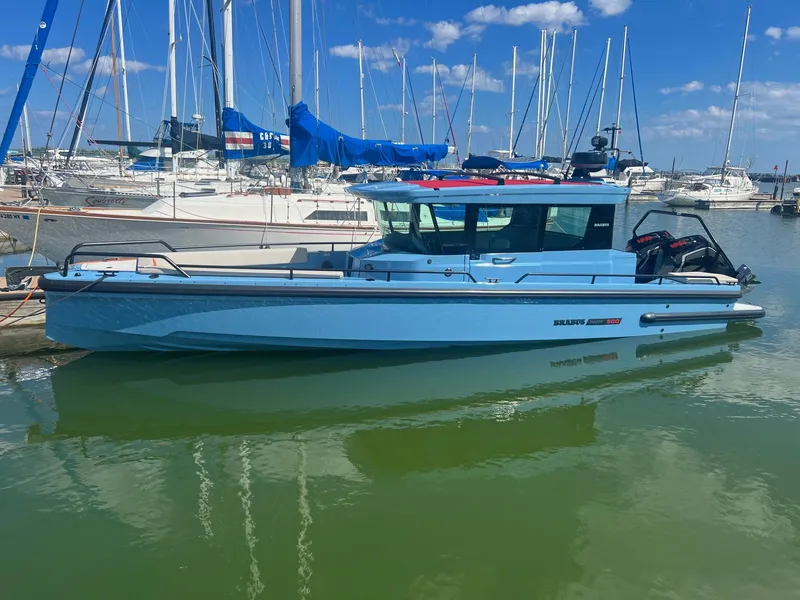Slide: The Image of 2023 BRABUS Shadow 500 Cabin boat docked in a marina. - 1