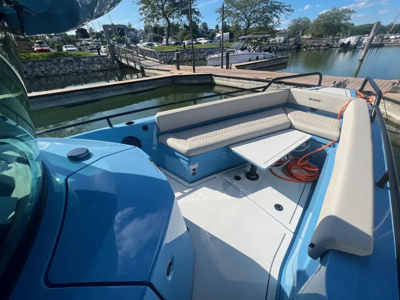 Slide: The Image of 2023 BRABUS Shadow 500 Cabin boat interior at a marina. - 16