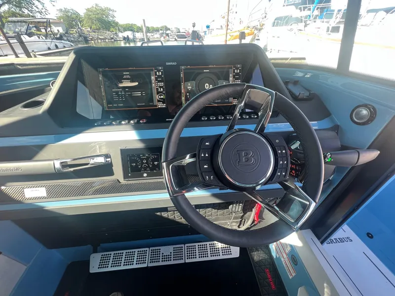Slide: The Image of Cockpit of 2023 BRABUS Shadow 500 Cabin with advanced navigation system and steering wheel. - 18