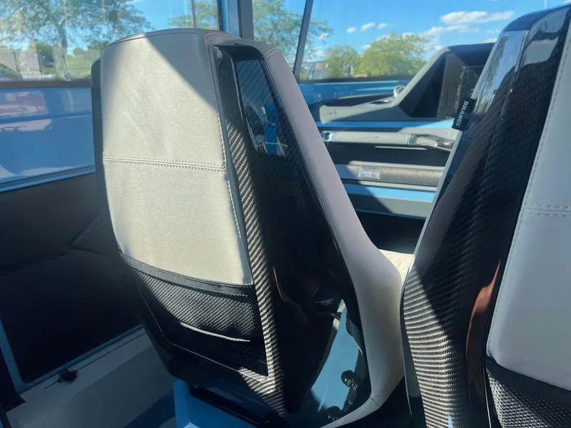 Slide: The Image of Interior seats of 2023 BRABUS Shadow 500 Cabin boat with carbon fiber accents. - 24
