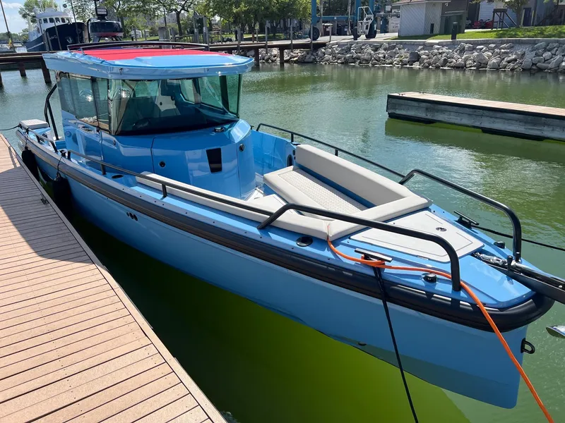 Slide: The Image of 2023 BRABUS Shadow 500 Cabin boat docked in a marina. - 3