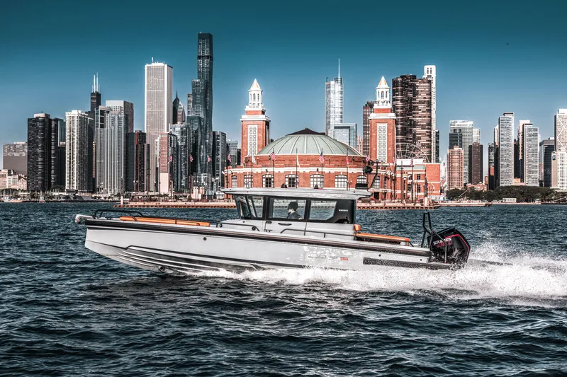 Slide: The Image of 2023 BRABUS Shadow 500 Cabin boat cruising near city skyline. - 33