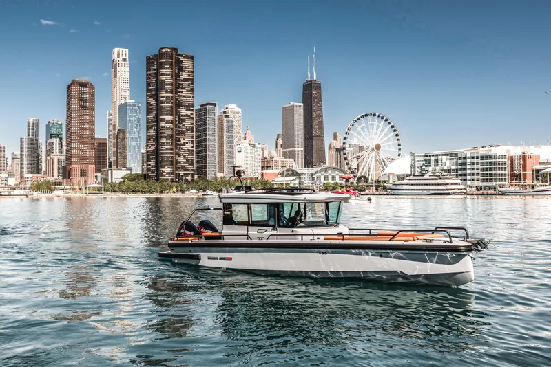 Slide: The Image of 2023 BRABUS Shadow 500 Cabin boat on water with city skyline background. - 34