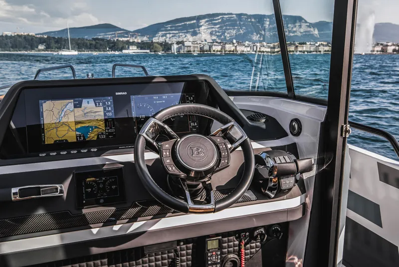 Slide: The Image of 2023 BRABUS Shadow 500 Cabin boat interior with steering wheel and navigation screens. - 38