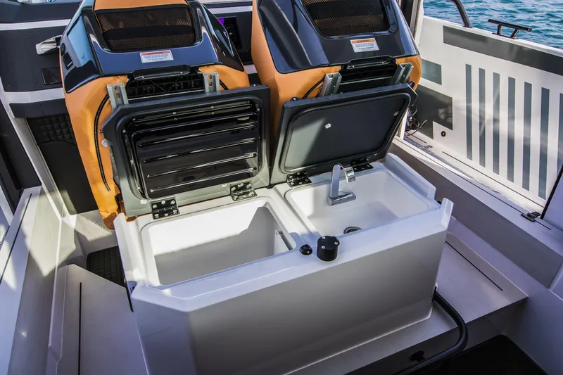 Slide: The Image of BRABUS Shadow 500 Cabin 2023 interior with open storage compartments and sink. - 39