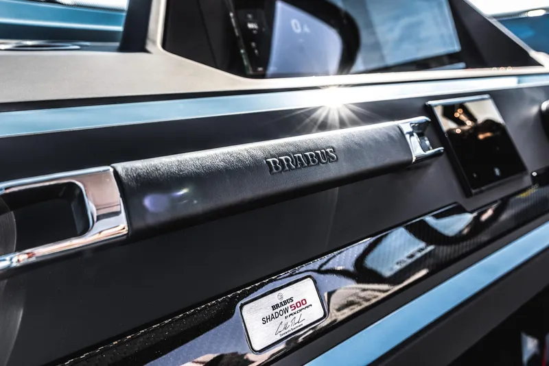 Slide: The Image of 2023 BRABUS Shadow 500 Cabin interior detail with logo and nameplate. - 40