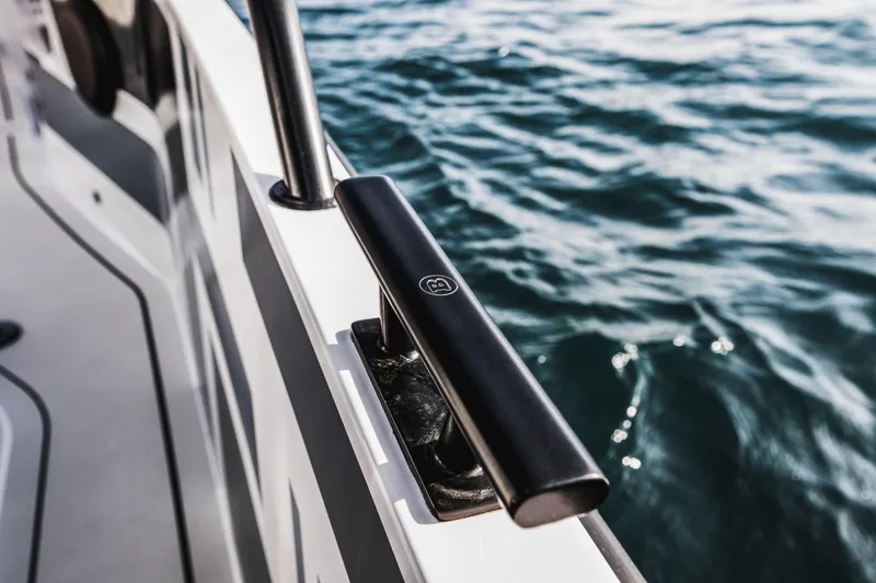 Slide: The Image of 2023 BRABUS Shadow 500 Cabin boat detail with ocean background. - 42