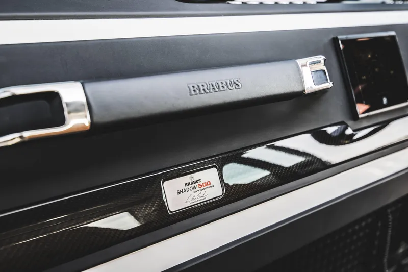 Slide: The Image of 2023 BRABUS Shadow 500 Cabin interior detail with branding. - 43