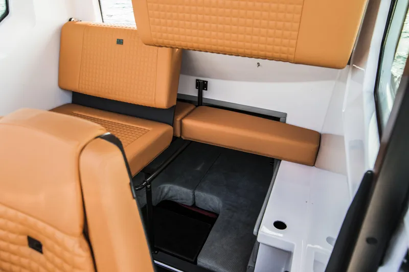 Slide: The Image of Interior of 2023 BRABUS Shadow 500 Cabin with tan leather seating. - 45