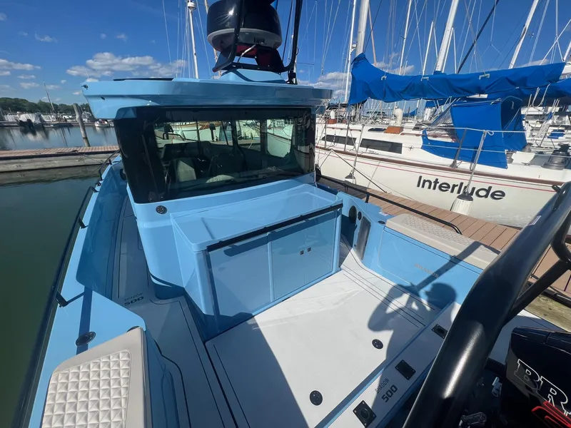 Slide: The Image of 2023 BRABUS Shadow 500 Cabin boat docked at marina. - 9