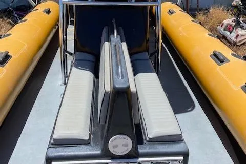 Slide: The Image of 2008 Ribcraft 9.0 inflatable boat with yellow pontoons and central seating. - 3