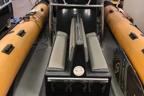 Slide: The Image of 2008 Ribcraft 9.0 inflatable boat interior with seating and equipment. - 9