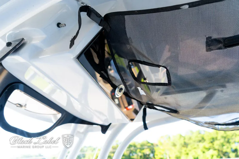 Slide: The Image of 2024 Finseeker 220 FinSeeker boat interior with storage netting and sleek design. - 19