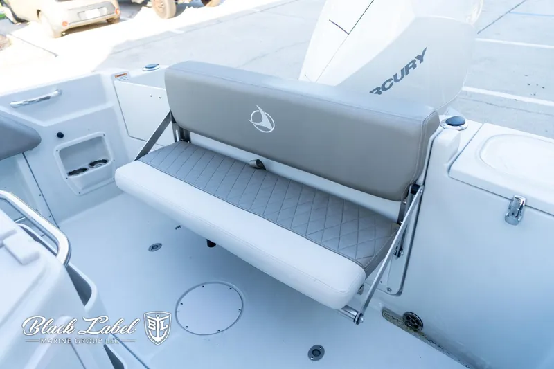 Slide: The Image of 2024 Finseeker 220 FinSeeker boat interior with foldable bench seat and Mercury engine. - 21