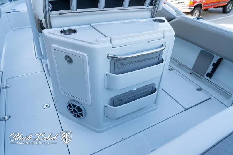 Slide: The Image of 2024 Finseeker 220 FinSeeker boat interior with storage compartments and speaker. - 22