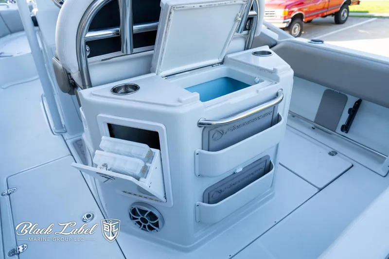 Slide: The Image of 2024 Finseeker 220 boat interior with storage compartments and seating area. - 23