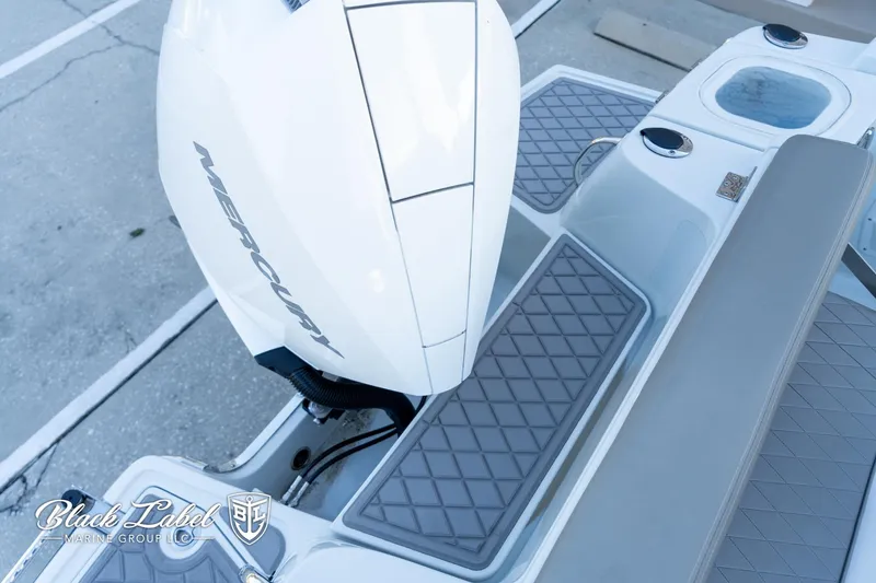 Slide: The Image of 2024 Finseeker 220 FinSeeker boat with Mercury engine, featuring sleek design and modern amenities. - 26