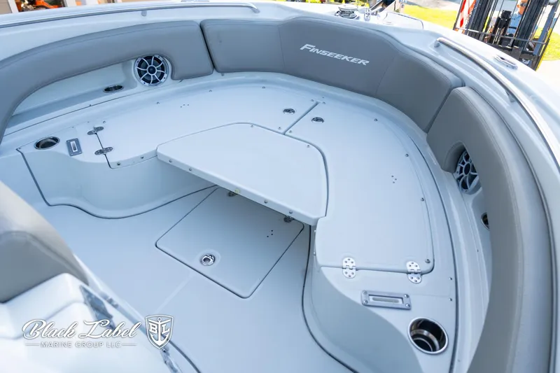 Slide: The Image of 2024 Finseeker 220 FinSeeker boat interior with seating and storage compartments. - 5