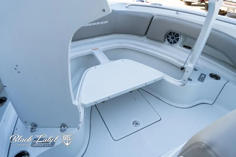 Slide: The Image of 2024 Finseeker 220 boat interior with seating and storage, by Black Label Marine Group. - 7