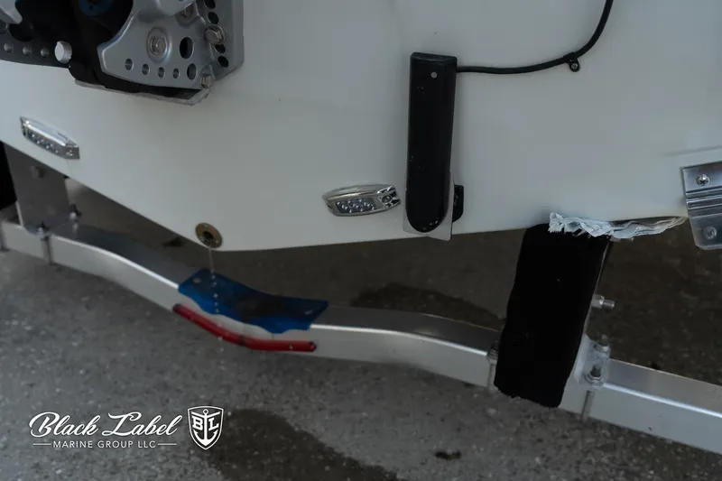 Slide: The Image of 2024 Finseeker 230 boat trailer detail, Black Label Marine Group branding visible. - 5
