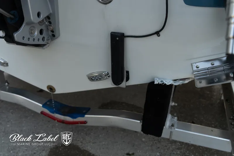 Slide: The Image of 2024 Finseeker 230 boat trailer detail, featuring Black Label Marine Group branding. - 6