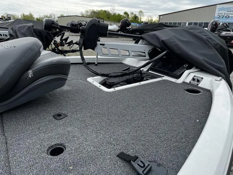 Slide: The Image of 2024 Vexus AVX1880C boat interior with gray carpet and seating. - 2