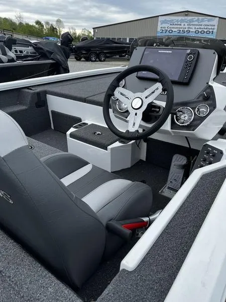 Slide: The Image of 2024 Vexus AVX1880C boat interior with steering wheel and control panel. - 3