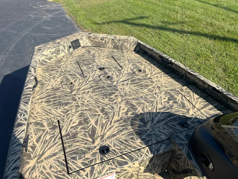 Slide: The Image of 2024 Lowe Outlet 20 boat with camouflage deck pattern. - 10