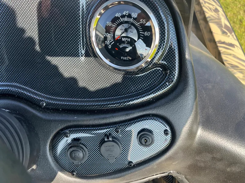 Slide: The Image of Dashboard of 2024 Lowe Outlet 20 boat with speedometer and fuel gauge. - 17