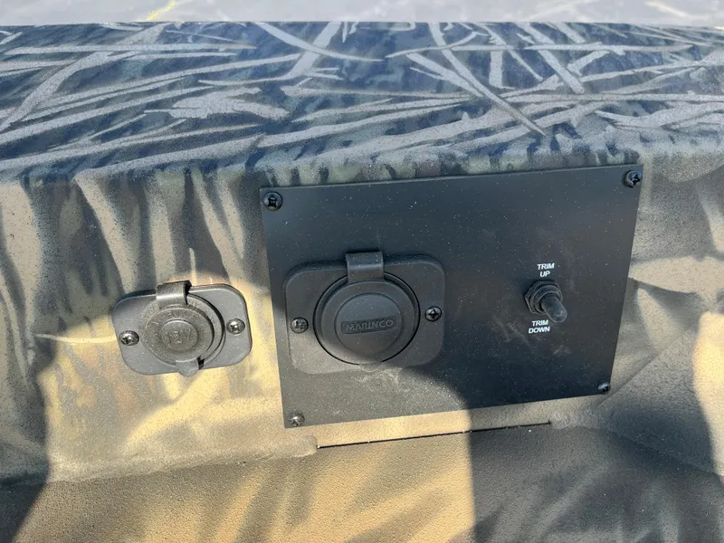 Slide: The Image of 2024 Lowe Outlet 20 control panel with power outlets and trim switch. - 19